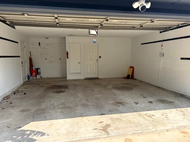 The same garage with an empty, swept concrete floor
