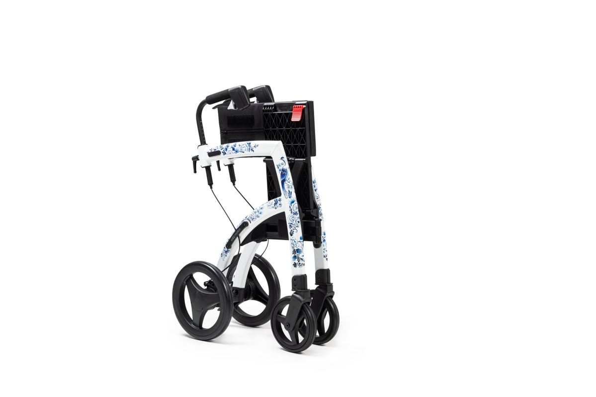 A rollator walker with a seat and hand brakes