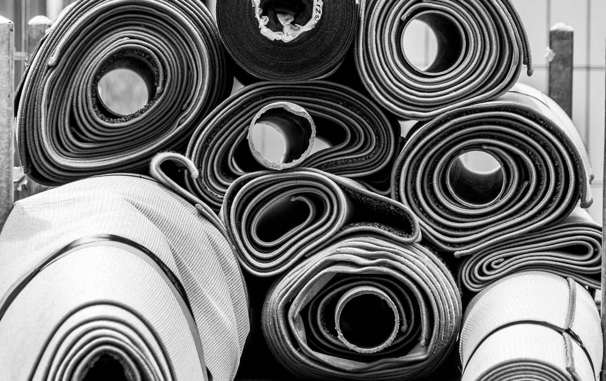 Rolls of carpet stacked together