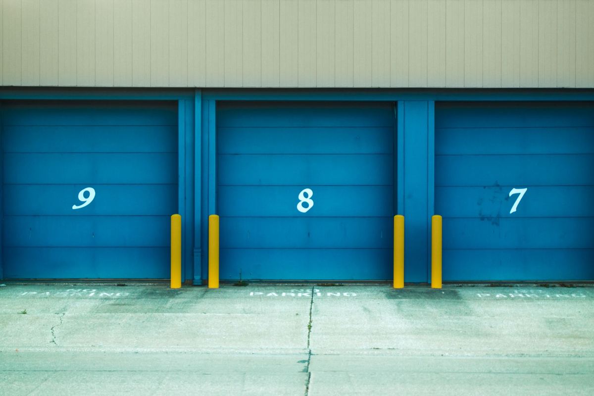 A row of blue storage unit doors