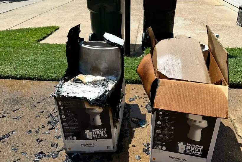 Two toilets at the curb, one burned, picked up same day