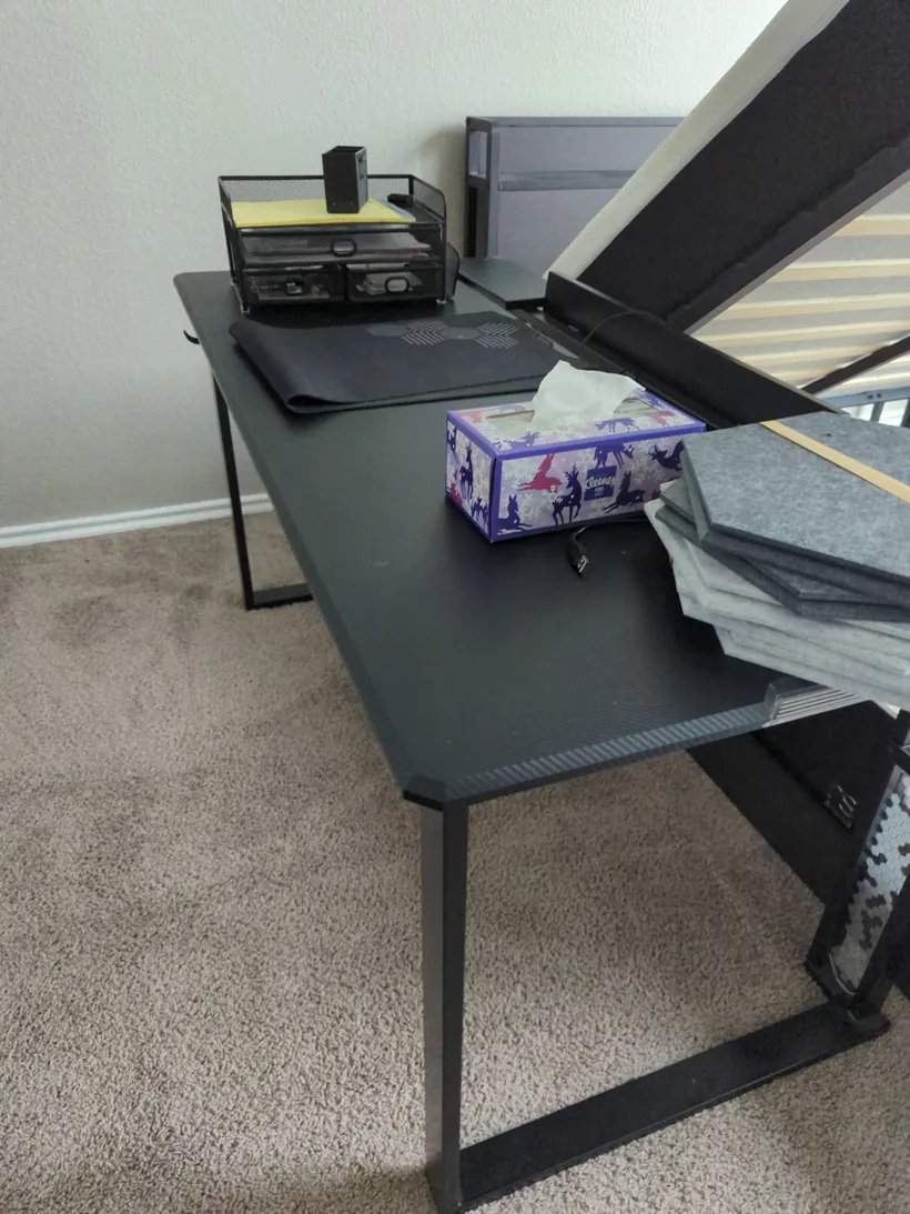 A black desk in a home office, ready for pickup