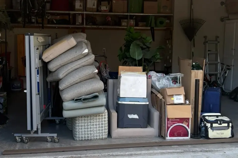 A garage stacked with items waiting for pickup