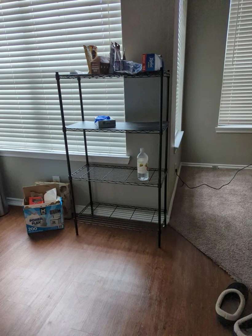 A black wire shelving unit, ready for pickup